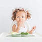baby girl eating with Ezpz Mini Mat - Sage